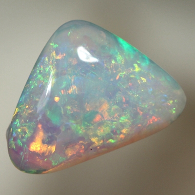 SOLID CRYSTAL OPAL Sparkles of orange and green in a 3D pattern 